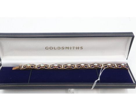 18ct gold enamelled panel bracelet, each of the eight sections set with opals and rubies, L: , 39.2g. UK P&amp;P Group 1 (£16