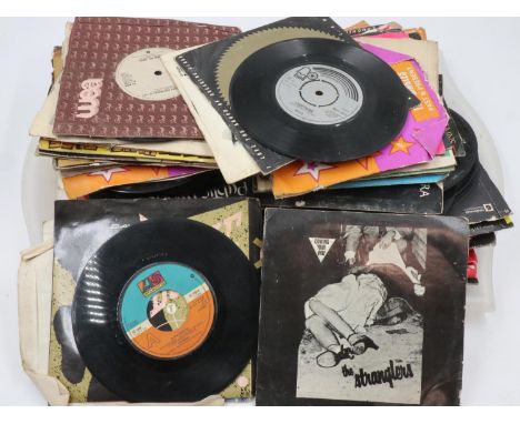 Approximately 80 singles including rock and punk. UK P&amp;P Group 3 (£30+VAT for the first lot and £8+VAT for subsequent lot