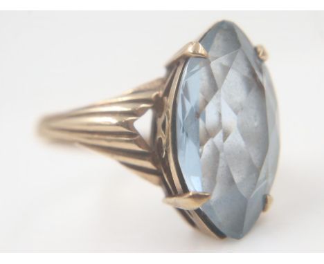 9ct gold solitaire ring set with a large marquis-cut aquamarine, size N/O, 4.8g. UK P&amp;P Group 0 (£6+VAT for the first lot