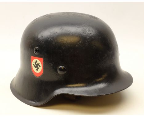 German WWll black painted steel Police Helmet with decals, interior stamped ET60 & 2058 with adjustable liner and chinstrap  