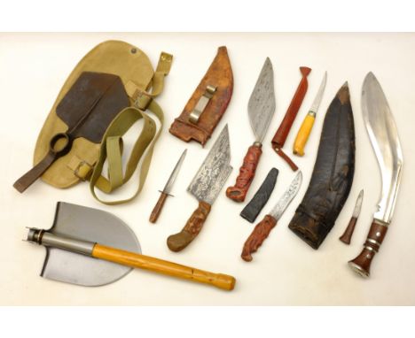 British Army entrenching tool stamped with arrow & 1941 in canvas pouch, a non-military folding spade, a Kukri knife, two kni