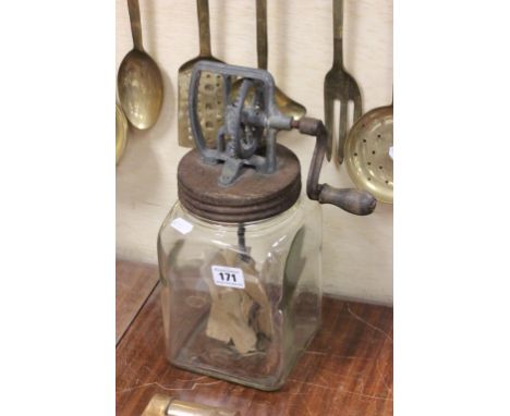 A vintage glass and wooden butter churn; made by the Blow Butter Churn Company