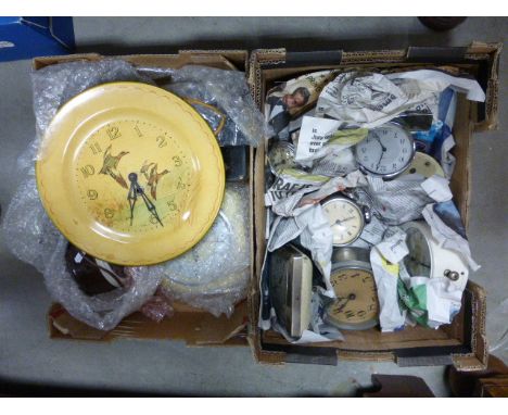 Two boxes of vintage clocks