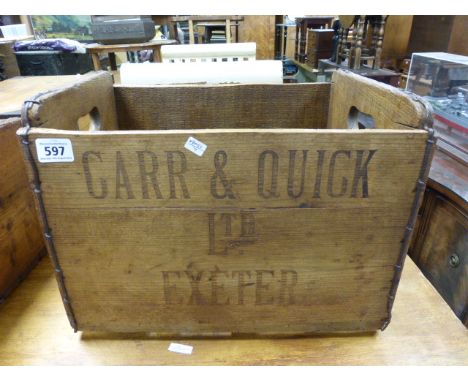 A vintage Carr & Quick pine bottle carrier
