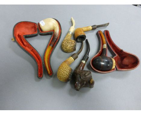 A group of five vintage pipes