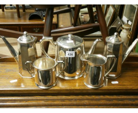 A Harrison Brothers & Howson for Harrods three piece silver plated coffee set together with two silver plated hot chocolate p