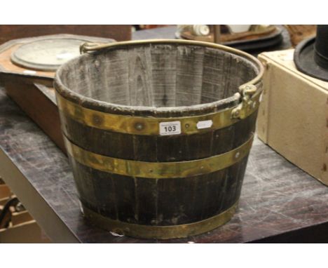 A vintage coal bucket made from a coopered barrel, with swing handle