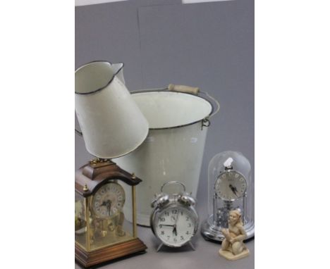 A vintage white enamel swing handle bucket together with a matching jug; two mantle clocks; an alarm clock and an erotic porc