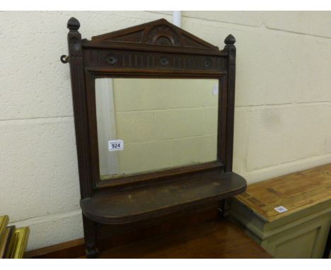 A mahogany wall mirror; with shelf