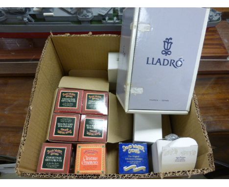 A box of various collectible ceramics to include Lladro and David Winter cottages