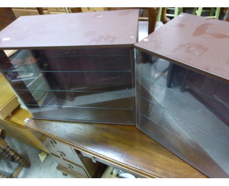 A pair of display cabinets; possibly for model vehicles 
