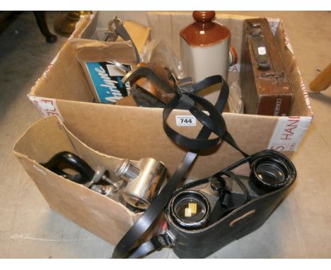 A box of various collectibles to include vintage irons; cameras; stoneware bottle etc