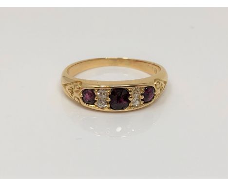 A gold diamond and ruby ring, size N CONDITION REPORT: Marks rubbed. 4g. 
