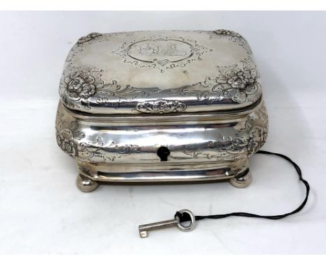 A 19th century German silver tea caddy, coat of arms to lid, on ball feet, original silver key.  CONDITION REPORT: 276g