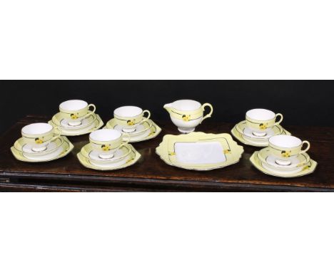A Paragon Art Deco tea service, decorated with panels of stylised flowers, on a yellow ground, a replica of a service made fo