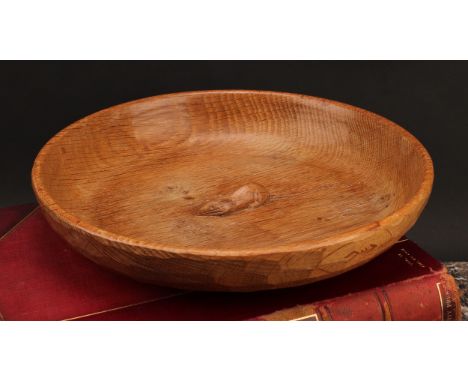 A Robert Mouseman of Kilburn shallow oak bowl, carved mouse signature to centre, typically adzed throughout, 29.5cm diameter