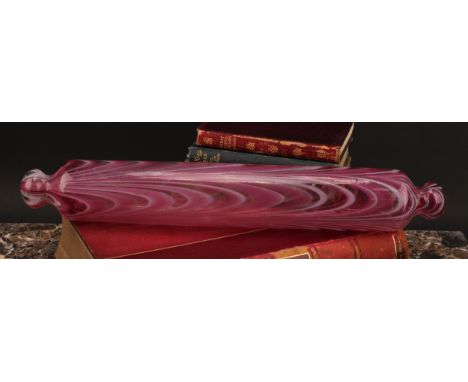 A Nailsea pink and white opaque glass rolling pin, 42cm