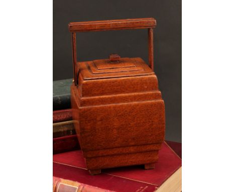An Art Deco light oak biscuit barrel or tea caddy, possibly a scratch built "apprentice" piece, stepped cover, angular handle