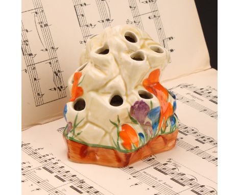 A Clarice Cliff, Crocus pattern posy vase or flower frog, modelled as a rocky outcrop, 9cm high