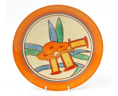 A Clarice Cliff Bizarre Fantasque Bobbins pattern plate, painted with stylised orange flowers and cotton reels, within a bold