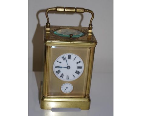 A gilt brass grande sonnerie carriage clock French, with alarm and push repeat. Grande / petite / silence switch at base. Whi