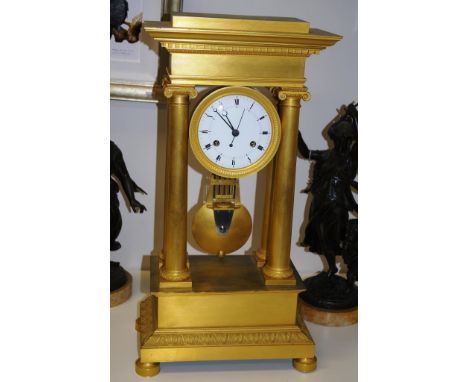 French Empire period ormolu portico mantel clock Empire period (1815 - 1820) table regulator in a classic portico case, signe