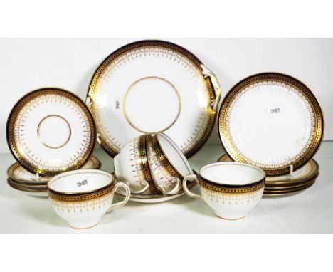 Royal Doulton part tea service RA 6738 marked to back, cobalt blue and gilt, consisting of four cups, five saucers, five side