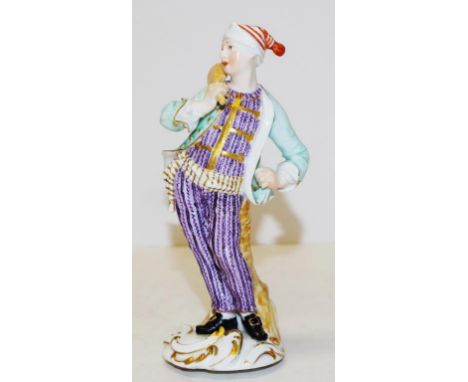 18th Century Meissen figure of a baker from the 'Cris de Paris' series, with wearing a red striped cap, turquoise jacket and 