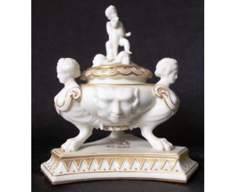 Antique Worcester classical form inkwell with standing cupid form finial to lid, on classical form bowl, supported by three t
