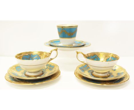 Pair vintage Aynsley trios gilt decoration on blue ground, design # 910; together with a Victorian Royal Worcester trio, embo