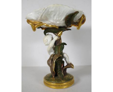 Antique Moore Brothers figural centrepiece cupid figure on gilded foliage, supporting a white ceramic leaf form dish, on gild