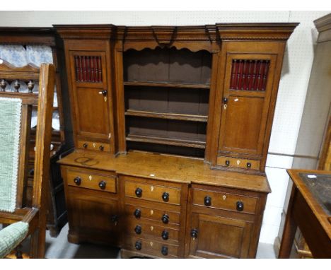     An Antique Oak Dresser, Having A Three Shelf Rack With Side Spindle Cupboard Doors &amp; Drawers, The Breakfront Base Hav