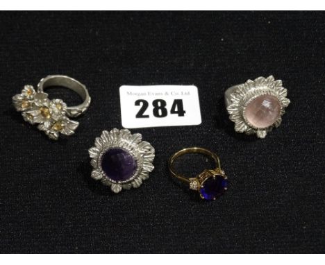     An Amethyst Set Gold Ring, Together With Three White Metal Dress Rings          