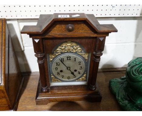     An Edwardian Oak Encased Mantel Clock With Silvered Dial                        