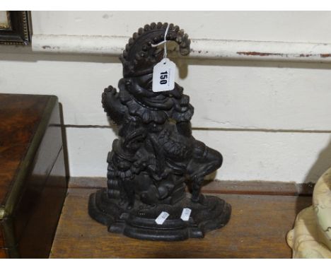     A Cast Iron Door Stop In The Form Of "Mr Punch"                             