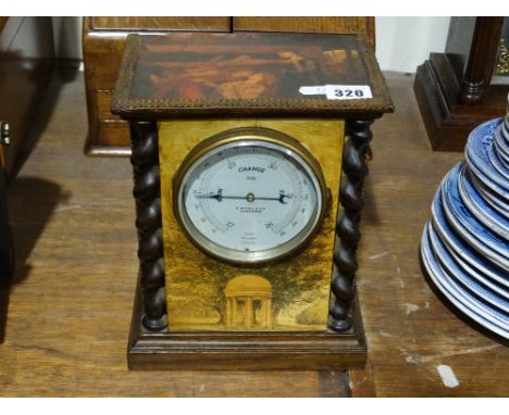     A Circular Dial Barometer Within A Table Clock Case                             