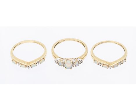 A QVC opal and diamond 9cty gold ring, comprising three graduated opals with small diamond set accents, width approx 6mm, siz