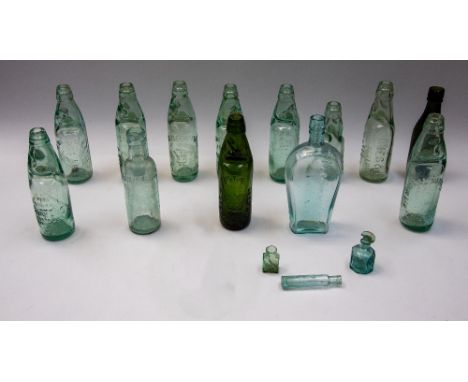 A collection of antique codd neck green soda bottles by different makers/sellers, still with glass marbles, good condition.