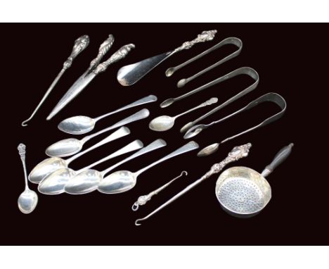 A collection of mixed silver flatwares to include; a pair of 18th century sugar tongs, initialled C.C, only lion passant mark