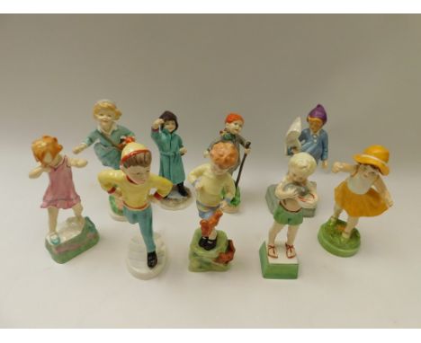 A group of nine Royal Worcester porcelain figures comprising February, model 3453; October, model 3417; November, model 3418;
