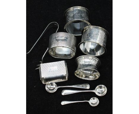 A collection of silver to include; a pair of Edwardian silver napkin rings with ribbed edges and engraved floral and foliate 