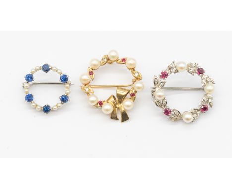A collection of three 9ct gold stone set garland brooches, including a sapphire and cultured pearl set white gold brooch, dia