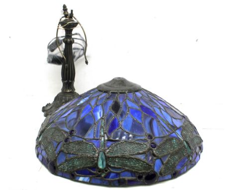 A 20th century Tiffany style leaded glass table lamp, decorated with butterflies in blues and greens raised on a pewter style