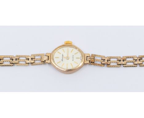   A Sovereign ladies vintage 9ct gold quartz wristwatch, oval silvered dial, baton markers, casec approx 15mm, to a 9ct gold 