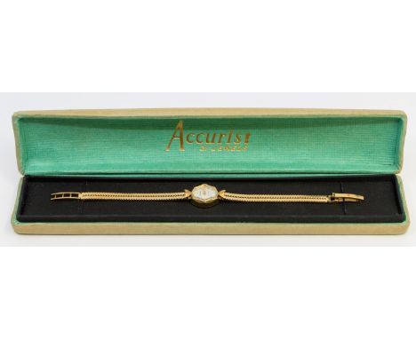 A ladies 9ct gold vintage Accurist 21 jewels wristwatch, comprising a octagonal silvered signed dial, with applied baton mark