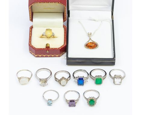 An opal and diamond 9ct gold dress ring, stamped 9ct, size P, total gross weight approx 3.3 grams with one silver pendant on 