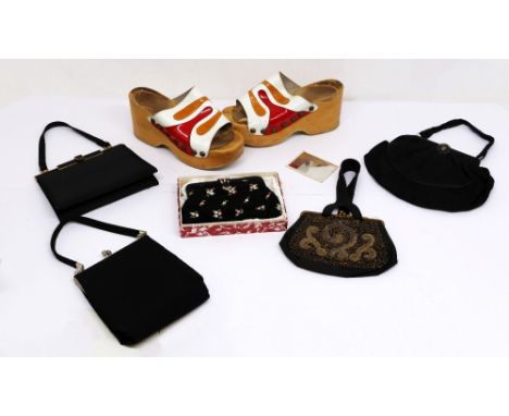 A small collection of evening purses to include a 1930s black cloth/grogan evening purse with gold braided type scroll patter