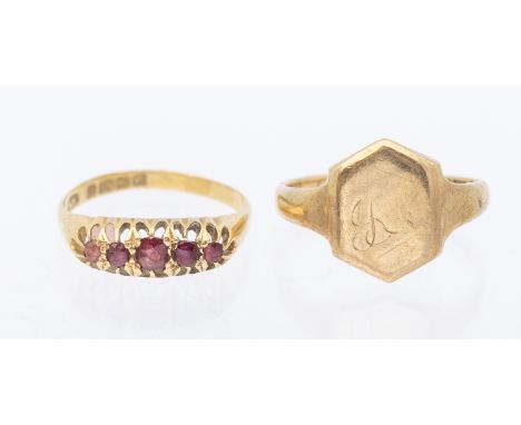 A ruby and 18ct gold five stone ring, set with mixed cut rubies with two replacement garnet stones to outer, width approx 6mm