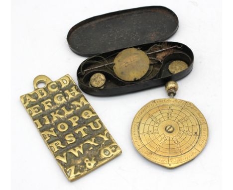George III tin cased pocket scales with weights, c1772, George III pocket date dial along with a George II child's brass alph