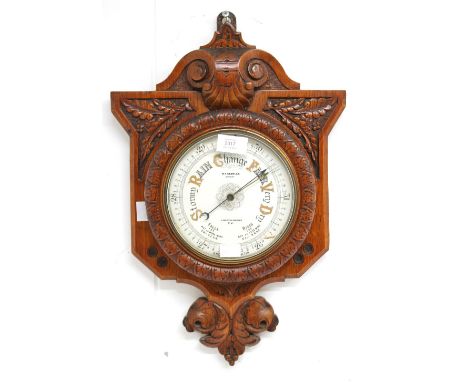 A late Victorian oak wall hanging barometer by W.F. Stanley, London Bridge.